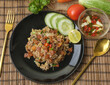Fried rice with sliced chinese sausage decorate by ingredient on wooden decoration style.