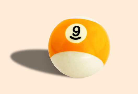 Wall Mural -  - Billiard (pool) ball yellow color number 9 (nine) on a background colour #faebd7