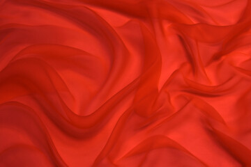 Wall Mural - Red chiffon or silk material. Satin fabric close up background and texture with copy space.
