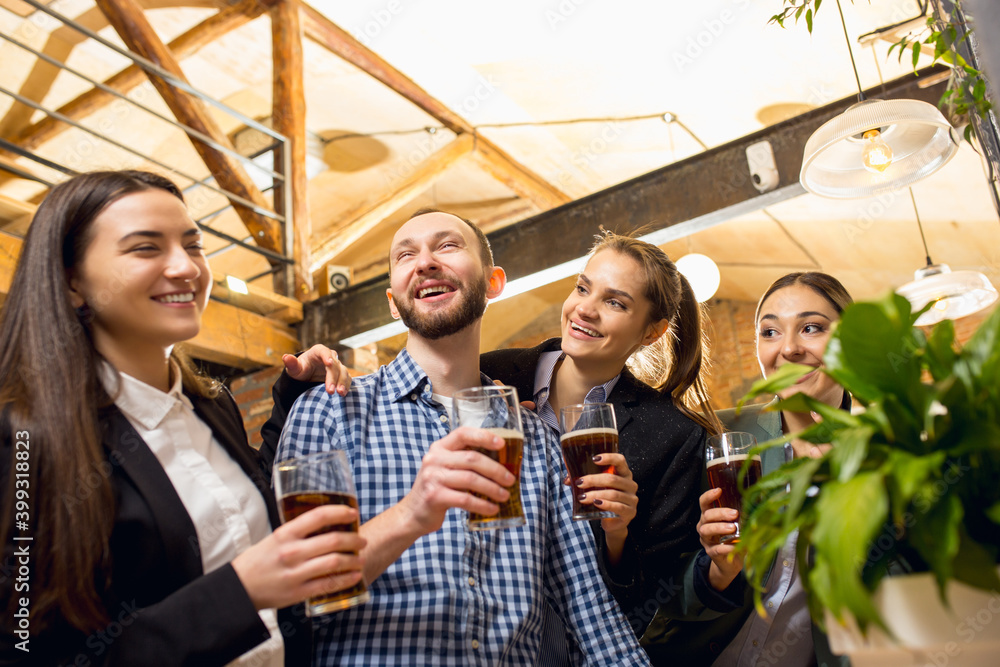 Weekend Teamwork Having fun. Happy co-workers celebrating corporate event after ...