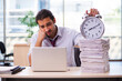 © Elnur - Young male employee unhappy with excessive work in the office