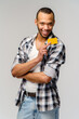 © Anatoly Repin - Young african-american man smiling and showing credit card with empty copy space