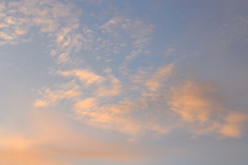 Wall Mural - pink clouds illuminated by the sun at dawn or sunset. evening or morning dramatic sky