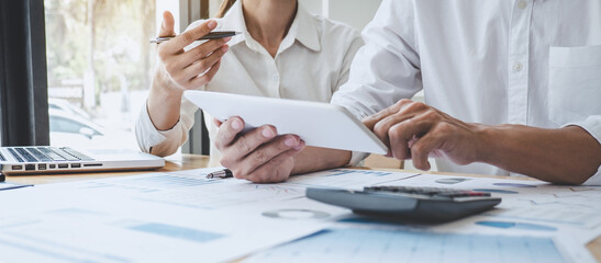 Fototapete - Two business colleague meeting to brainstorm the new project business strategy plan and analysis data document, finance and accounting concept Briefing, brainstorming, consulting
