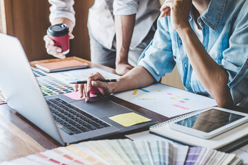 Wall Mural - team of creative web/graphic designer planning, drawing website ux app for mobile phone application 