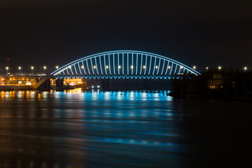 Wall Mural - View of the Podilskyi Bridge with bright lights at night