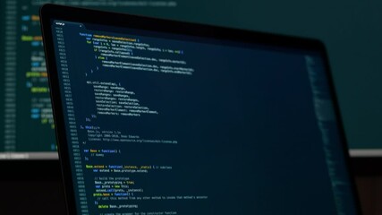 Real Javascript code. Front end web development. Java script JS code on laptop screen. Web design concept.