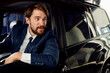 © SHOTPRIME STUDIO - business man in suit driving car in showroom and emotions model