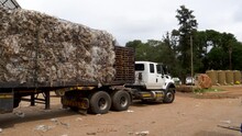 Plastic Pollution.  Truck Piled High With Compressed Blocks Of Plastic Leaving A Recycling Site