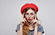 © SHOTPRIME STUDIO - Beautiful woman in red hat Irochka bright makeup fashionable earrings model