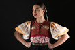 © muro - Young beautiful slovak woman in traditional dress. Slovak folklore