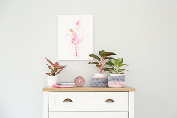 Wall Mural - Different houseplants on chest of drawers near light wall