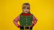 © Andrii Iemelianenko - Displesed blonde kid teenager girl in elf Santa helper costume has spoiled mood on Christmas Eve isolated on yellow background. Child negative emotions, hate, rage, upset, stress. New Year holidays