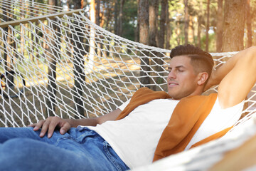 Sticker - Handsome man resting in hammock outdoors on summer day