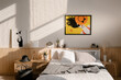 © Alina Hvostikova/Stocksy - Bright mosaic hanging over bed in cozy bedroom