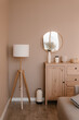 © Alina Hvostikova/Stocksy - Wooden furniture and vases in cozy room