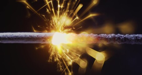 Wall Mural - FHD video of Burning sparkler firework with hot glowing embers on black background