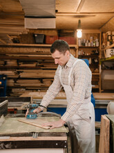 Male Joiner Polishing Lumber Plank