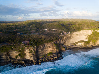 Wall Mural - Aerial view of Uluwatu Temple (Pura Luhur Uluwatu) Balinese Hindu temple located in Uluwatu sea. It is renowned for its magnificent location, perched on top of a cliff.