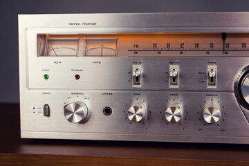 Wall Mural - Vintage Audio Stereo Receiver with shiny metal front panel