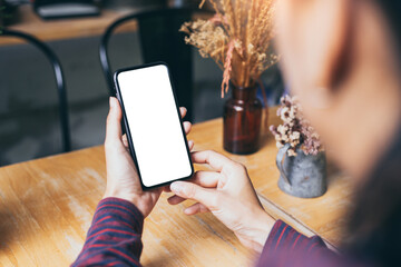 cell phone blank white screen mockup.woman hand holding texting using mobile on desk at office.background empty space for advertise.work people contact marketing business,technology