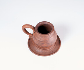 ceramic product with your own hands, made on a Potter's wheel, isolated on a white background