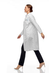 Sticker - medicine, profession and healthcare concept - happy smiling female doctor or scientist in white coat walking