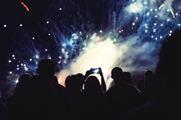 Wall Mural - Crowd watching fireworks and celebrating new year eve