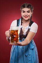 Wall Mural - Young woman with a pint of beer