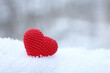 Valentines heart on a snow in winter park. Background for Christmas holiday, romantic greeting card