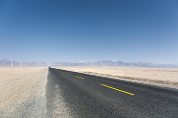 Poster - asphalt road through the wind farm