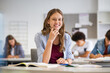 © Rido - Happy smiling student girl studying in classroom