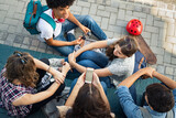 Multiethnic friends laughing and talking after school lesson