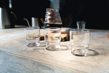 Drip coffee, barista pouring water on coffee ground with filter