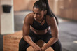© Flamingo Images - Fit woman looking exhausted at the gym