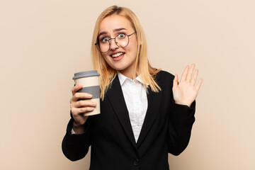 Wall Mural - young blonde woman looking nervous, anxious and concerned, saying not my fault or I didn’t do it