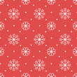 Christmas pattern with white snowflakes on a red background.
