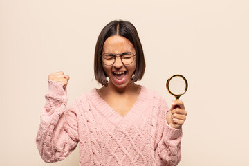 Canvas Print - young hispanic woman feeling happy, surprised and proud, shouting and celebrating success with a big smile