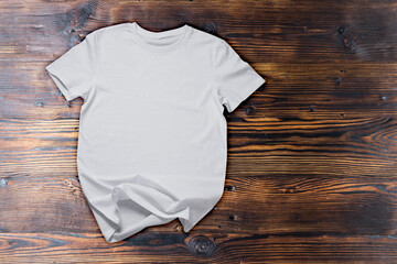 White Unisex cotton t shirt on dark wooden background, Mockup