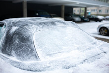Frozen Glass And Roof Of A Convertible Car In Winter, Snow On The Tarpaulin.