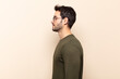 © kues1 - young handsome man on profile view looking to copy space ahead, thinking, imagining or daydreaming