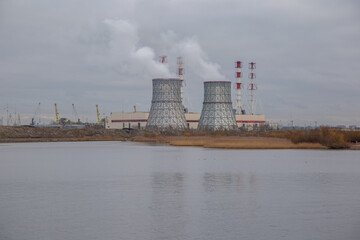 View of the power plant on the shores of the Gulf of Finland. Yugo-Zapadnaya CHPP Saint Petersburg Russia. Smoke from chimneys.