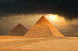 The Famous Pyramids At Giza In Egypt With A Dramatic Sky