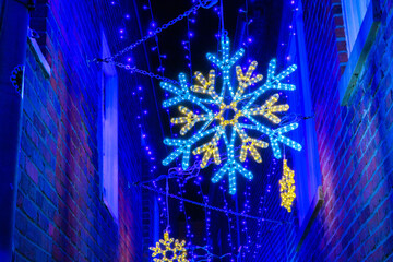 holiday lighting annapolis maryland ornament christmas snow flake alley winter night
