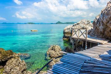 Sticker - Tropical island rock and wood bridge on the beach with blue sky. Koh kham pattaya thailand.