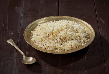 Indian Cumin Rice or Jeera Rice on Wooden Background