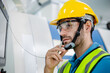 © winnievinzence - Male engineer worker working with industry machine at industrial factory. technology invention manufacturing. career and professional skill. diversity people working together. copy space
