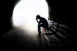 dramatic concept, Silhouette of Sad Depressed man sitting