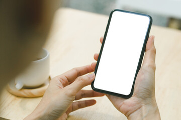 cell phone blank white screen mockup.woman hand holding texting using mobile on desk at office.background empty space for advertise.work people contact marketing business,technology