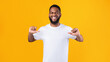 Happy African Man Pointing Thumbs At Himself Over Yellow Background